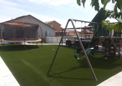 Artificial Grass in backyard with play set